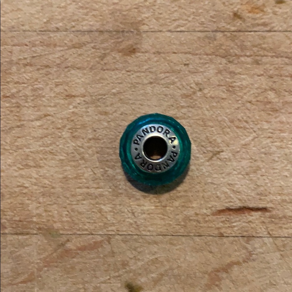 Teal-colored Pandora charm